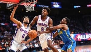 Shai Gilgeous-Alexander driving past Nuggets defenders during Thunder vs Denver game update